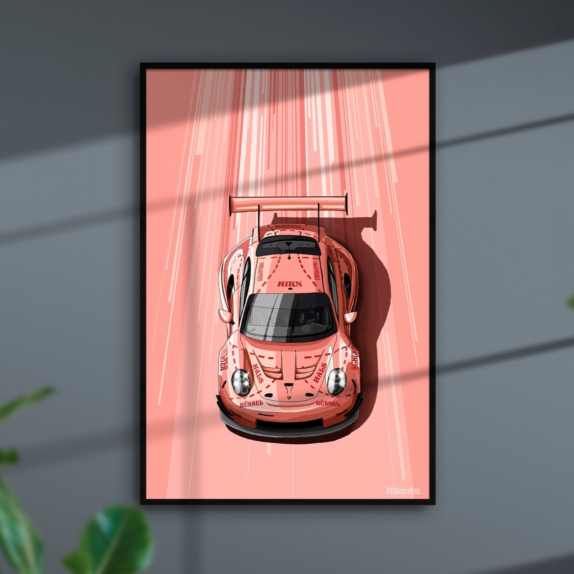 Porsche 911 RSR Pink Pig art print displayed in a home interior