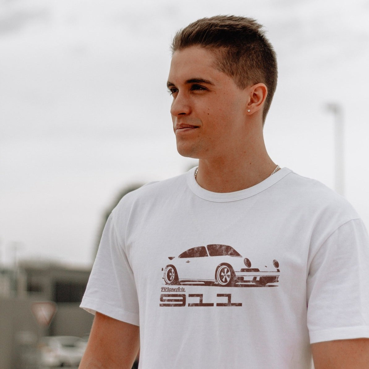 Young boy wearing a white Classic 911 T-shirt - PitLaneArts