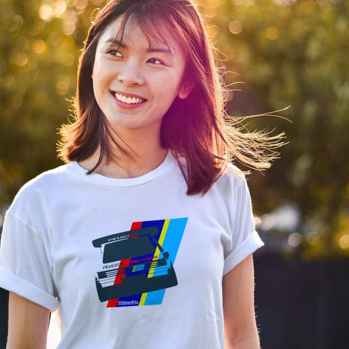 Girl wearing a white Peugeot 205 T16 T-shirt - PitLaneArts
