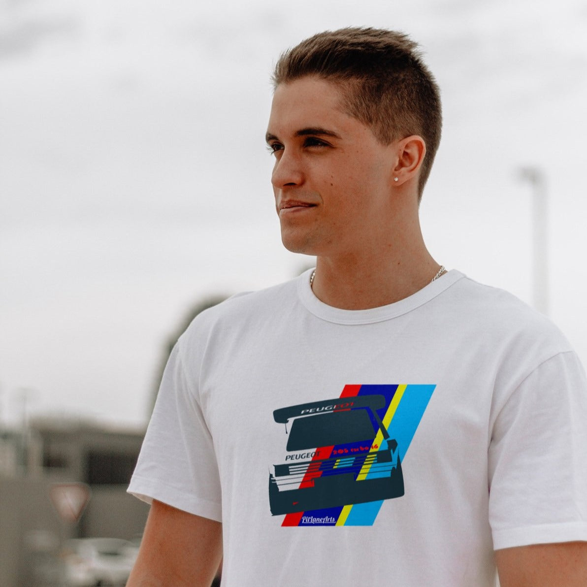 Man wearing a white Peugeot 205 T16 T-shirt - PitLaneArts