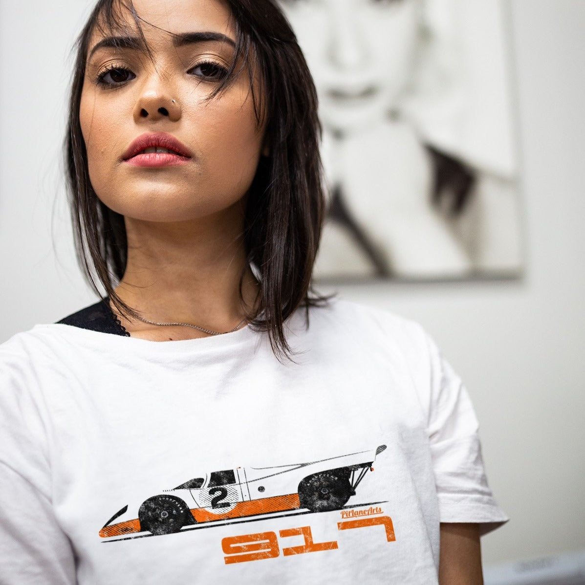 Girl wearing white 917 Le Mans Race Car T-shirt - PitLaneArts