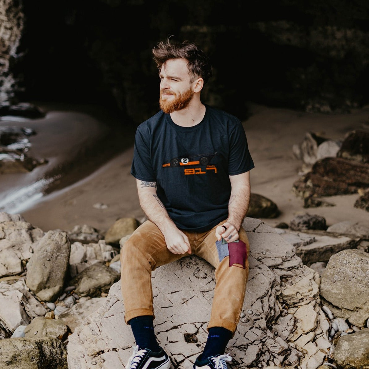 Bearded man wearing a black 917 Le Mans Race Car T-shirt - PitLaneArts