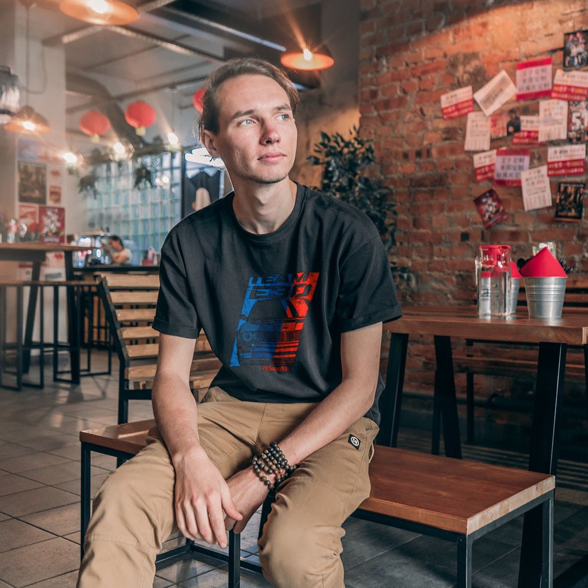 Man wearing dark heather grey Team E30 Tshirt