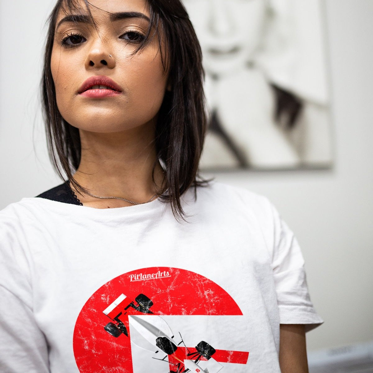 Girl wearing a white Ayrton Senna Race car T-shirt - PitLaneArts